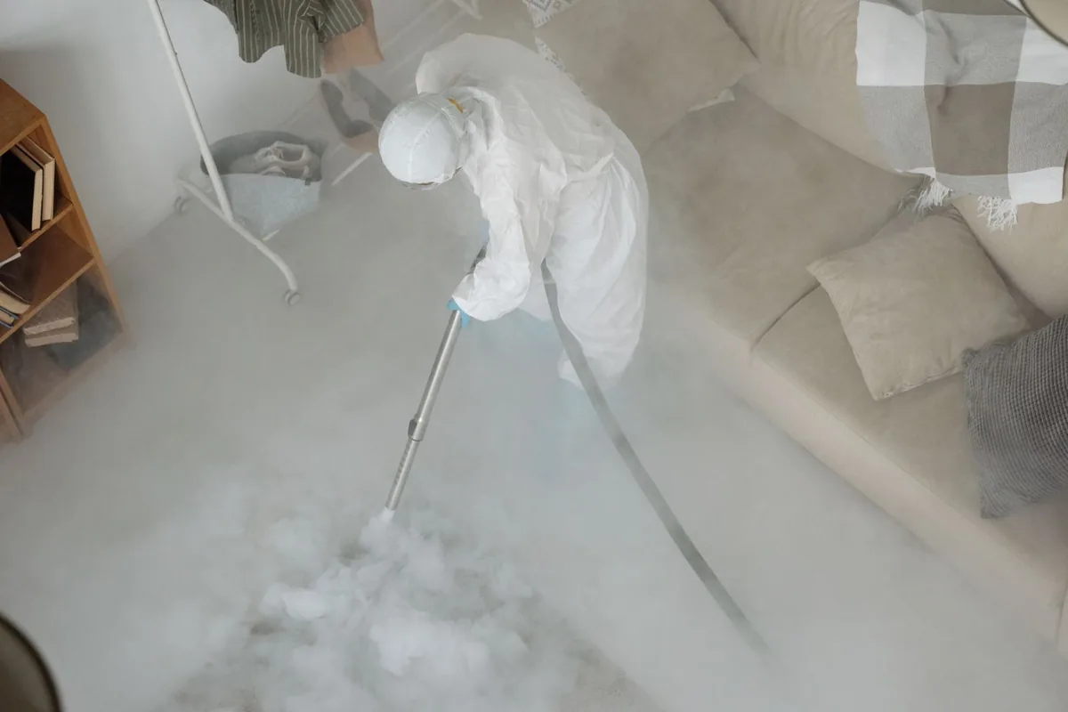 Biohazard cleanup technician in protective equipment, Morton, TX